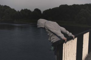 man over edge of river